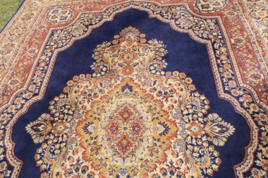 A modern Eastern design rug, the blue ground decorated with a central stylised medallion, 135ins x - Image 3 of 3