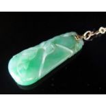 A Chinese Jadeite Pendant carved with leaves, c.40mm drop, and with unmarked gold mounts and 32"