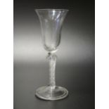 A Large 18th Century Drinking Glass with air twist stem and folded foot, 20.5cm tall