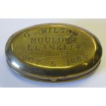 A Victorian Brass Oval Snuff Box, the hinged cover stamped G. WILSON. MOULDER LLANELLY OCT. 5.