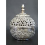 An Indian White Metal Pot and Cover with pierced, embossed and chased decoration, 10cm high, 187g