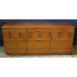 A Danish Rosewood Veneered Stereo Cabinet with central hinged record player compartment with