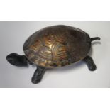 A 19th century Cast Iron Tortoise Bell with clockwork movement operated by depressing head or
