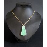 A Chinese Carved Jadeite Pendant (43mm) on an 18" 9ct gold chain, 8.8g