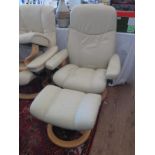 A Ekornes Stressless Recliner & Foot Stool In Cream Leather.