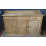 Large Pine Sideboard. Three drawers over three Doors. H. 115cm, W. 175cm, D. 50cm.