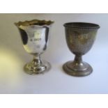 A Birmingham Silver Egg Cup with chased foliate swag decoration and one other, 75g