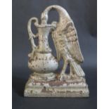 Antique Cast Iron Door Stop in form of a Bird Drinking from a Ewer. 27.5cm tall.