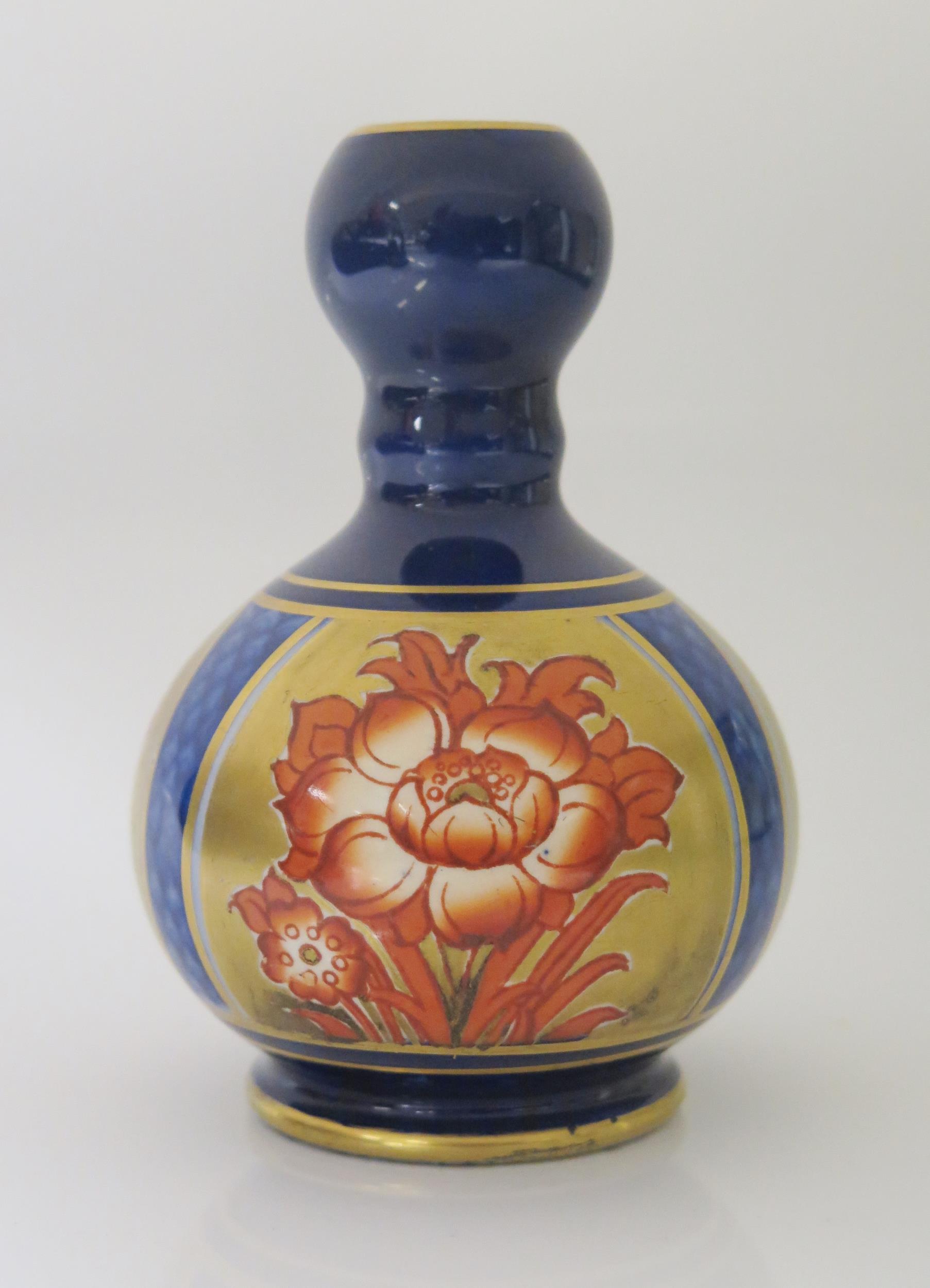 A Small Moorcroft MacIntyre Vase for A.M. Sheard Batley, various marks to base, 11cm