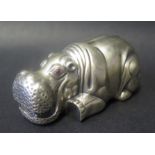 A Recumbent Pig Ornament with cabochon eyes, Russian marks to base, 6cm long, 30g