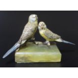 A Cold Painted Bronze Group modelled as a pair of budgerigars on an onyx base, 16cm wide