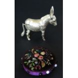 A Silver Plated Donkey Sewing Tape Measure (6.5cm long) and floral embroidered pin cushion