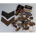A Collection of Military Cloth and Metal Badges and Buttons etc.