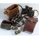 A Cased Pair of Early Binoculars, two other pairs and Voightlander camera