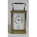A Gilt Brass Carriage Clock, 15cm. With key, not running, balance seems to be ok