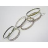 Three Silver Hinged Bangles, pair of enamelled silver bangles and one other, 85.8g