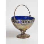 A George V Pierced Silver Swing Handled Sugar Dish with blue glass liner, Birmingham 1930, Adie