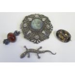 A Greek .800 Silver Shield Brooch (5.5cm), smoky quartz brooch and two others