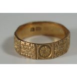 A Victorian 18ct Gold Decahedron Band with chased foliate decoration, 5.5mm diam., Chester 1887,
