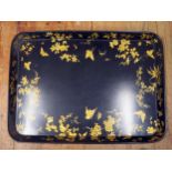 A Good and Large Victorian Papier-mâché Tray, the black ground decorated in gilt with butterflies