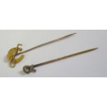 An Antique 15ct Gold Pin with horse shoe and whip finial (Chester1910, F.B, 1.2g) and one other