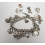 A Silver Charm Bracelet and loose charms, 73.4g