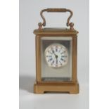 A Gilt Brass Sub Miniature Carriage Clock with enamel dial, 7.5cm high. Running, with key