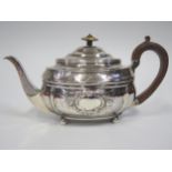 A George III Silver Teapot with embossed and chased decoration, London 1808, CF, 411g **IVORY FINIAL