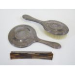 An Elizabeth II Silver Three Part Hand Mirror, Brush and Comb Set, Sheffield 2000, Carr's of