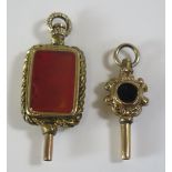 Two Antique Hardstone Mounted Watch Keys, largest 42mm