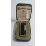 A Cased DUNHILL Rollagas Silver Plated and Black Enamel Lighter, 14073. Strikes, no gas