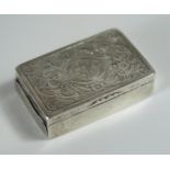A Silver Snuff with chased foliate scroll decoration, 18.6g. Unable to open