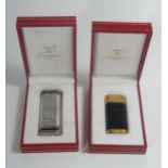 A Cased Cartier Mini Gold Plated and Black Lacquer Lighter, strikes and lights AND boxed solid