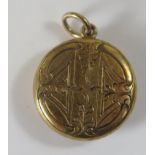 An Unmarked Victorian 15ct Gold Memorial Locket with hair glazed panel verso and chased foliate