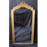 A Late Victorian Gilt Mirror with a moulded frame and ribbon cresting 77in. (196cm.) high, 40in. (