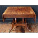 An Early 19th Century Mahogany Drop Leaf Sofa Table raised on twin lyre shaped supports with