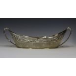 A Victorian Silver Two Handled Bread Basket with gadrooned base and pierced and chased scrolling