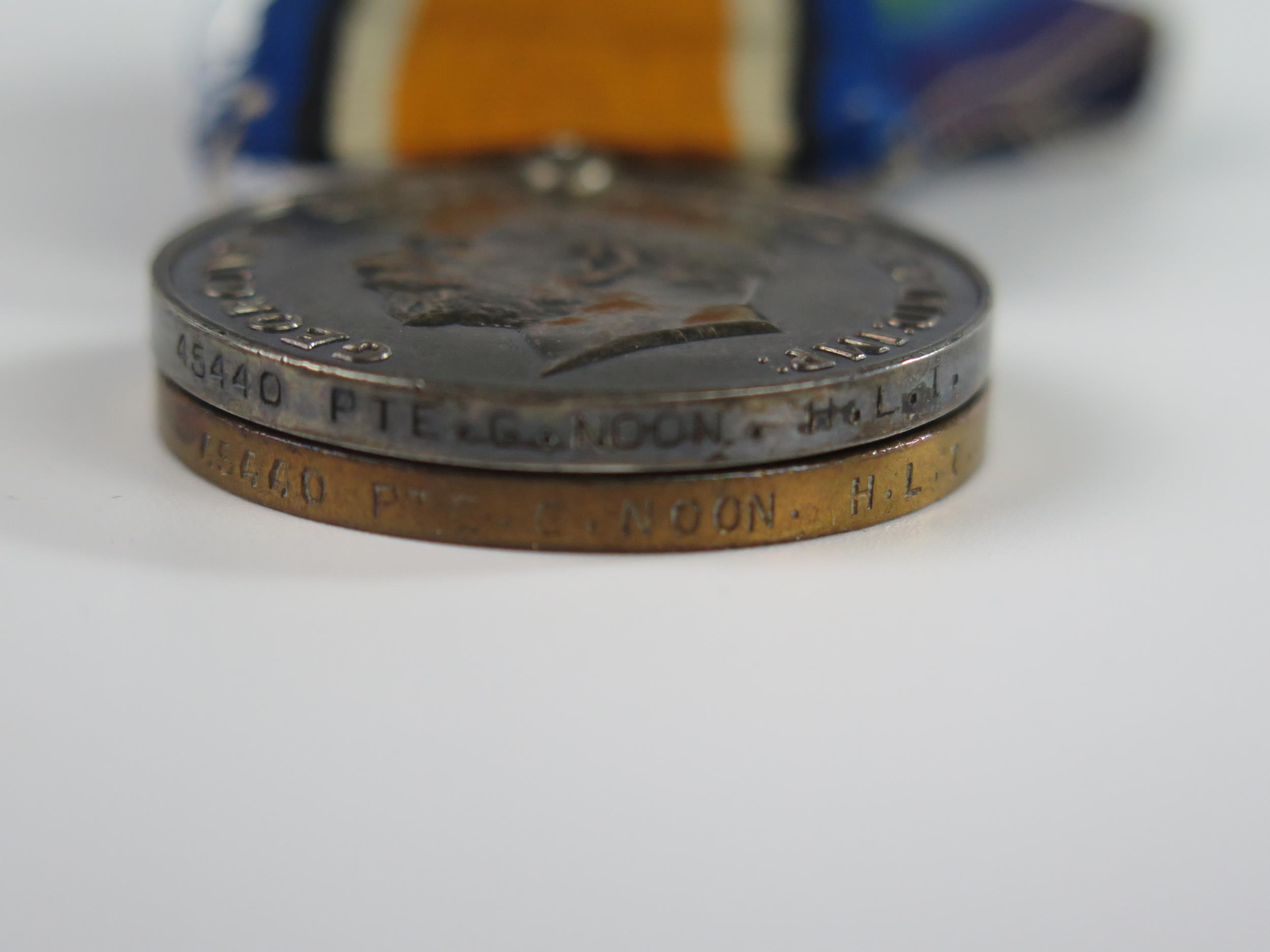 A WWI Two Medal Group awarded to 45440 PTE. G. NOON. H.L.I., a Christmas 1914 tin with piece of - Image 3 of 3