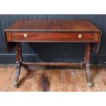 An Early C19th Regency Mahogany and Tulipwood Crossbanded Sofa Table with a frieze drawer, on