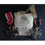 A WWII German Iron Cross Second Class in paper sleeve and War Merit Cross Second Class