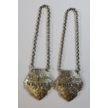 A Pair of Edward VII Cast Silver Irish Whiskey and Scotch Whisky Leaf Shaped Bottle Labels,