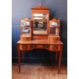 An Edward & Roberts Satinwood and Mahogany Shape Front Dressing Table with foliate marquetry
