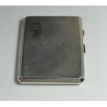 A George VI Silver Cigarette Case with engine turned decoration and contemporary initials,