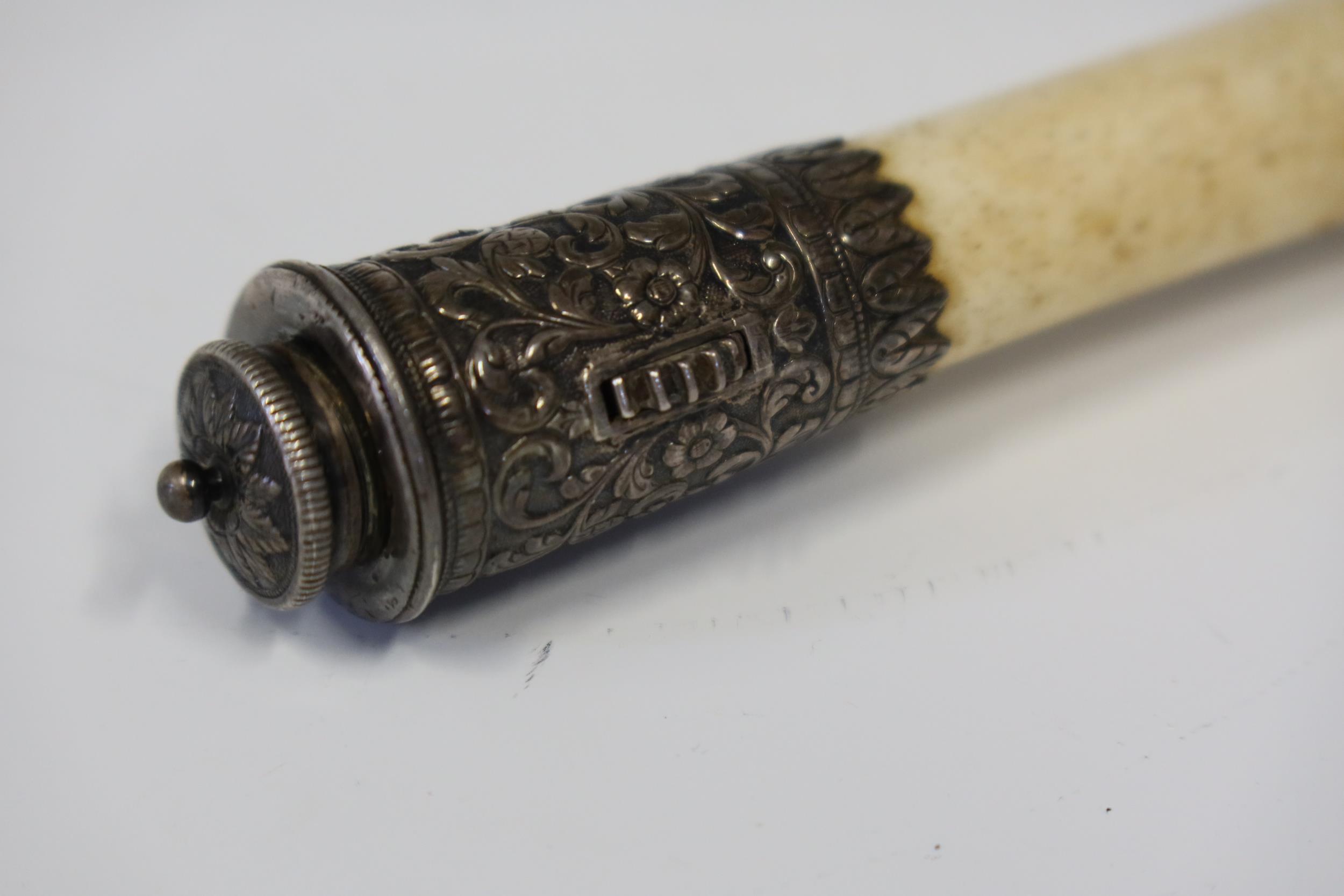 An Indian Silver Mounted Bone, one end with screw top and rotating cog and other open, 21cm long - Image 2 of 4