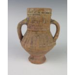 An Early Egyptian Terracotta and Painted Two Handled Vessel, 15.5 cm
