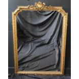 A Late 19th Century French Gilt Composition Overmantle Mirror with a floral cartouche cresting above