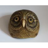 A Rare Antique Owls Head Clock Bell Push, modelled in plastic with glass eyes on a metal base, 9.5cm