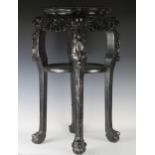 A 19th Century Chinese Carved Rosewood and Marble Top Two Tier Stand with a pierced foliate frieze
