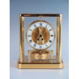 A Jaeger-LeCoultre Atmos Clock, Cal 540 13 jewel movement, white enamelled dial with black Roman