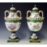 A Pair of 19th Century Porcelain Two Handled Vases with Covers, the moulded body with a white ground